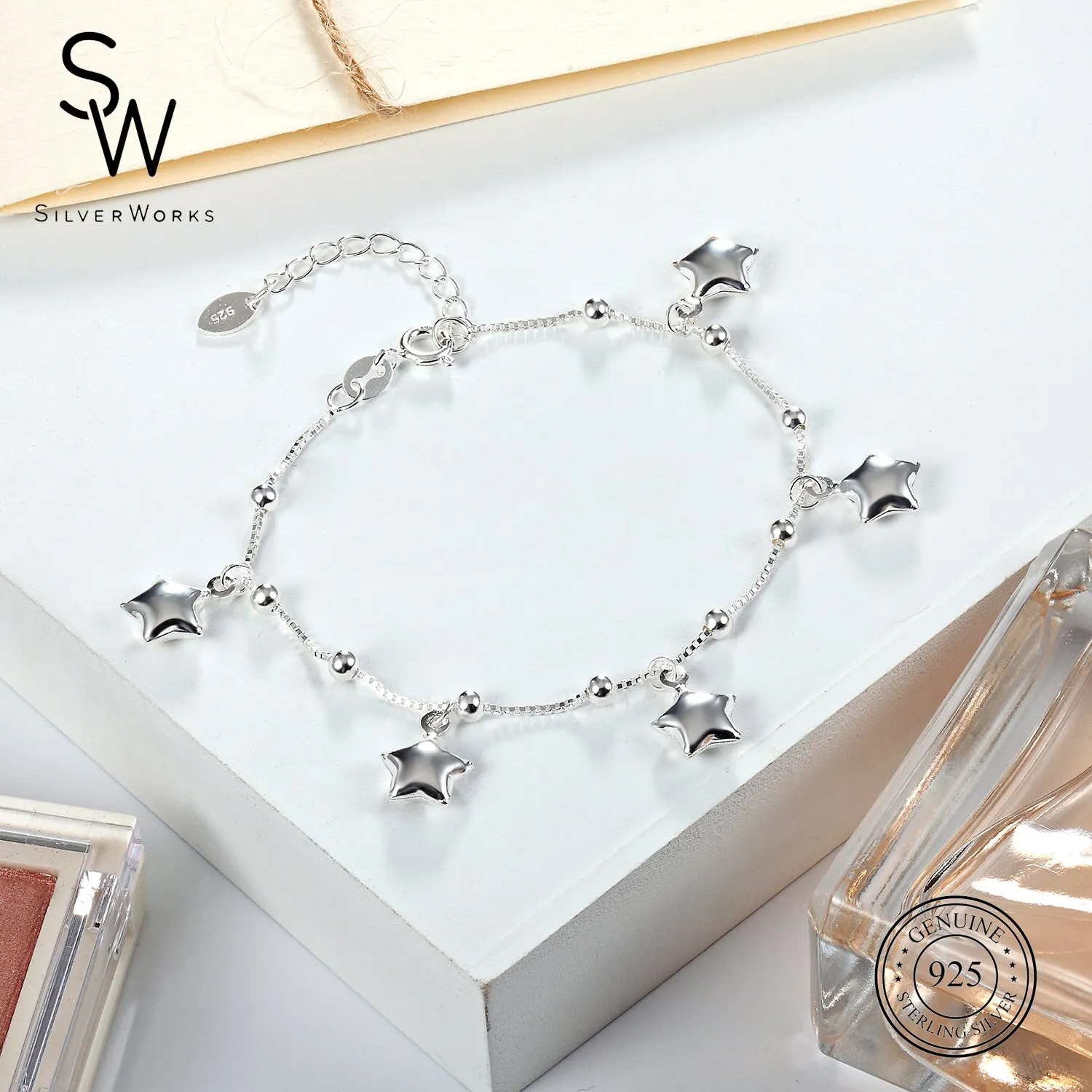 B4614 BRACELET W/DNGLNG 5 STARS 8"